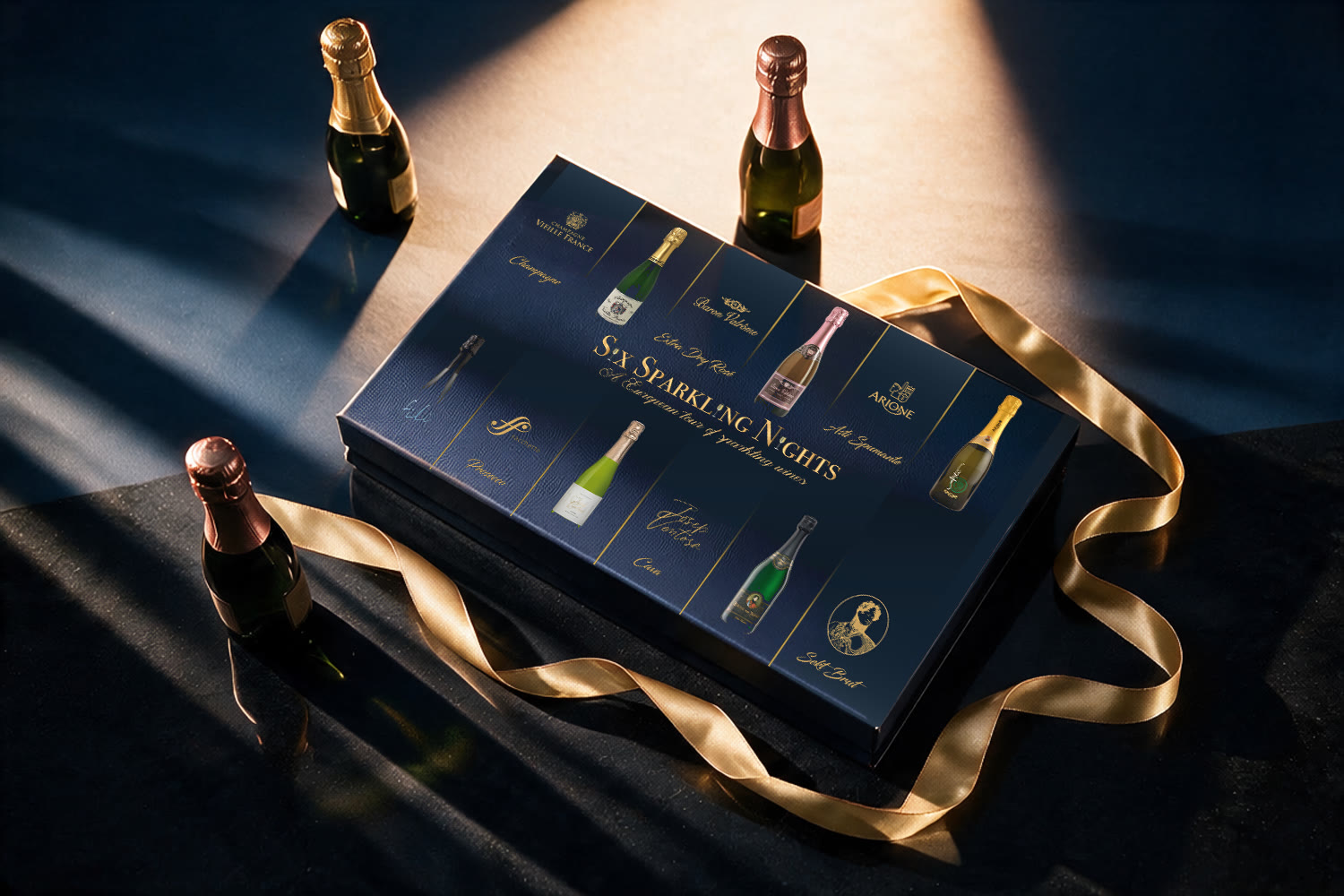 The 2020 box closed under a shaft of low light, three unopened miniature bottles around it and a gold ribbon trailing across the front