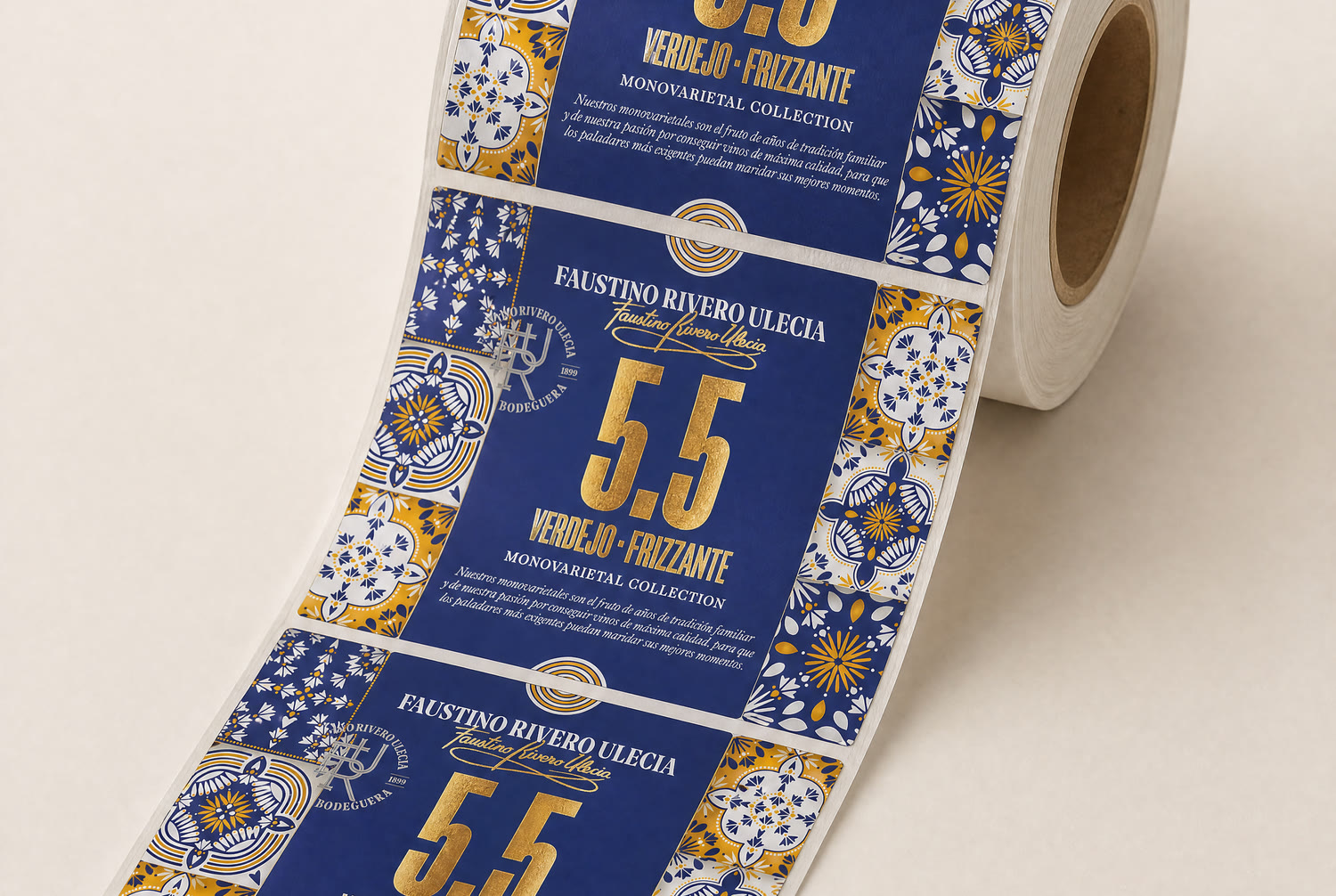 The printed labels coming off the roll, one whole label centred, the tile border repeating down the web